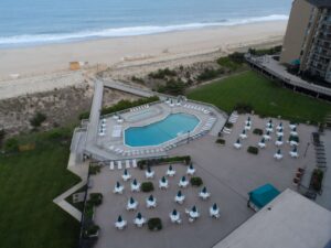 The view of the pool area of a Bethany Beach rental where you can tell tides from.